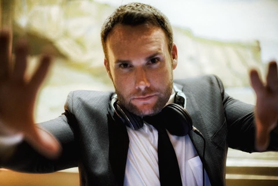 Ryan Damron, founder of Just Dance Events, with headphones around his neck